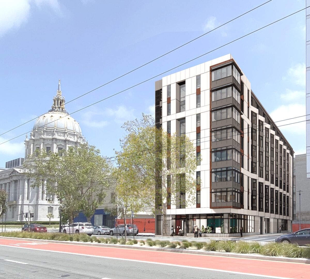 The Kelsey Civic Center as seen from Van Ness Street, a light-colored building with windows and brown paneling.