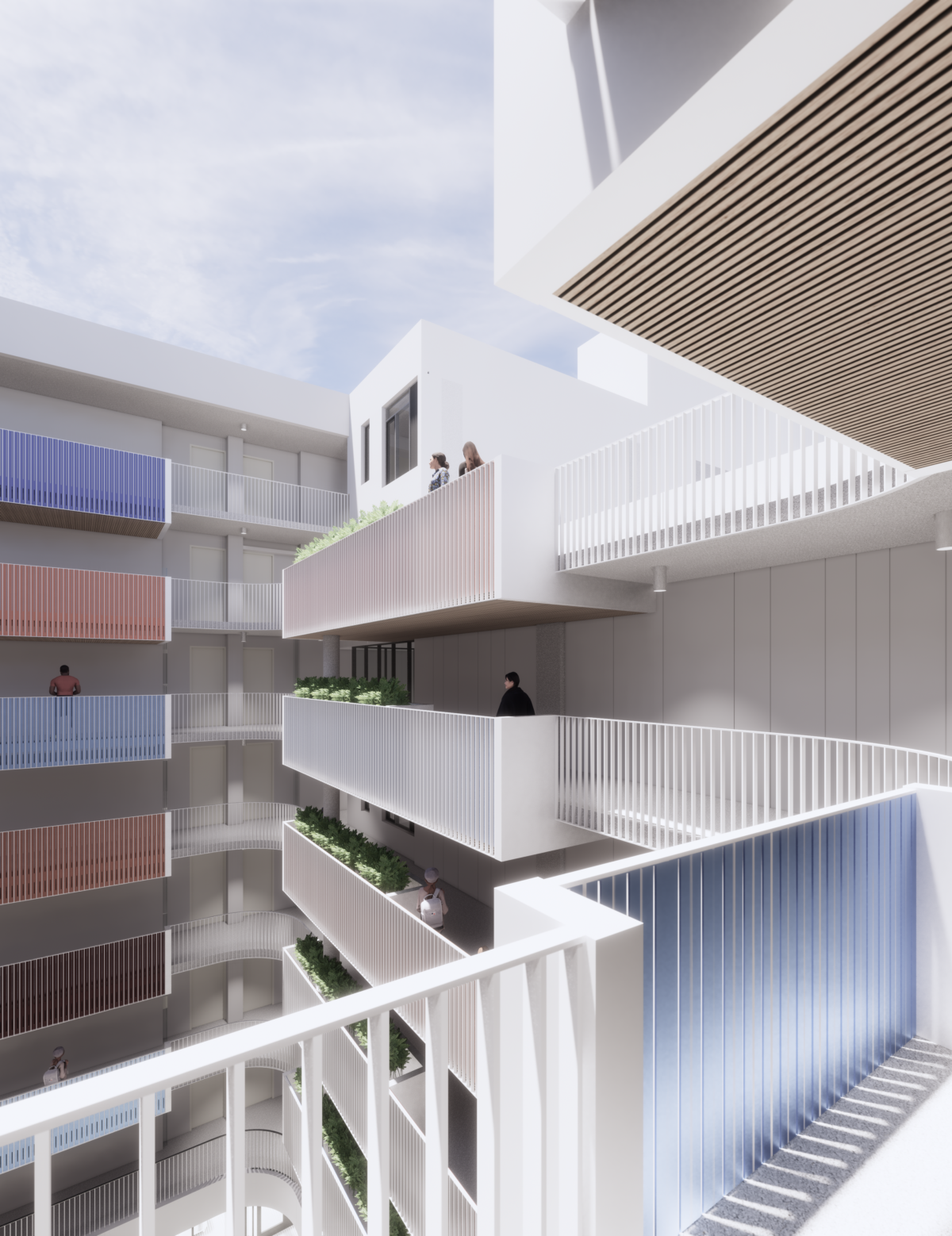 The courtyard of The Kelsey Civic Center with red and blue colored railings on the balconies