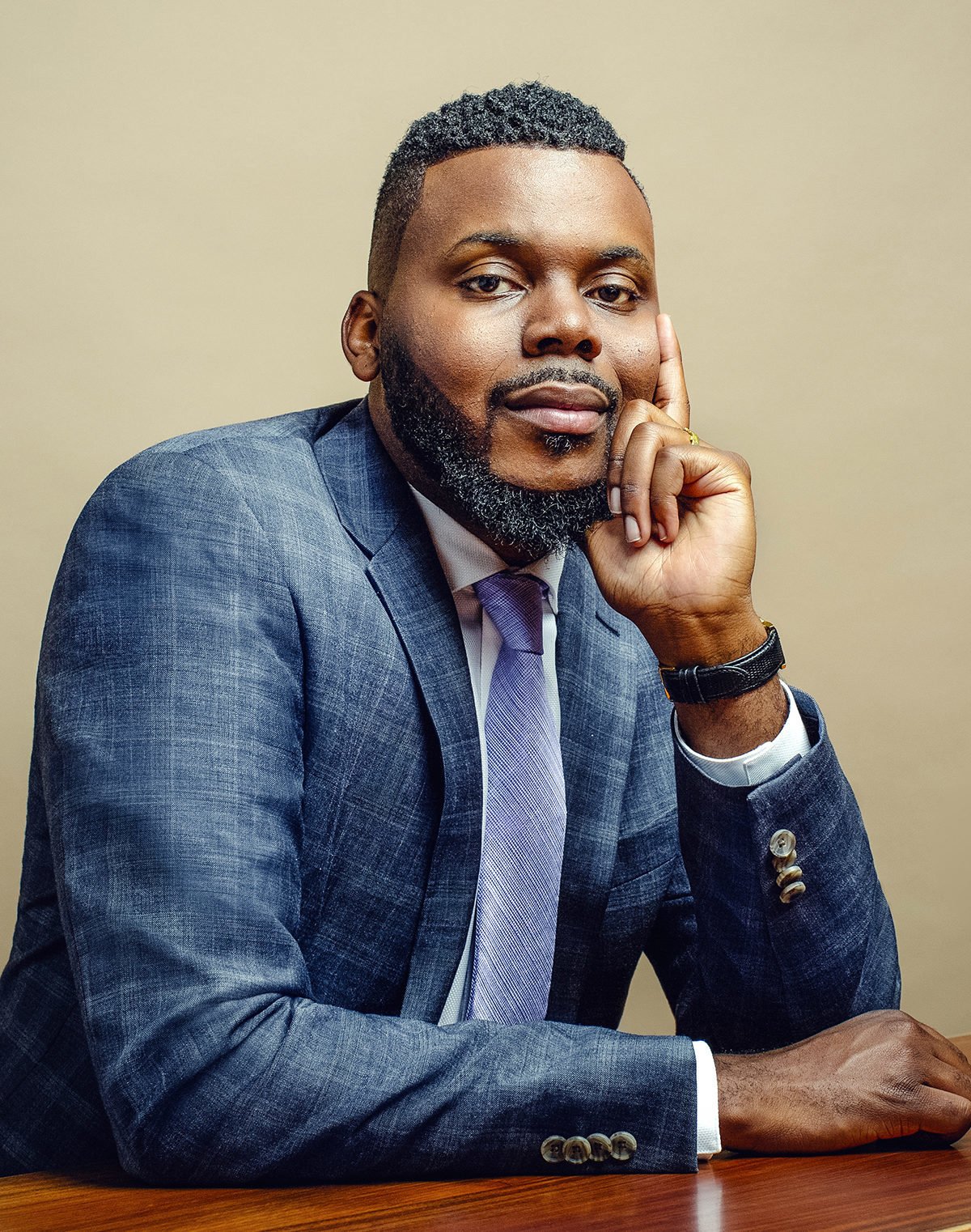 Mayor Michael Tubbs is pictured. He is a dark-skinned man who has short hair, a beard, and is wearing a suit.