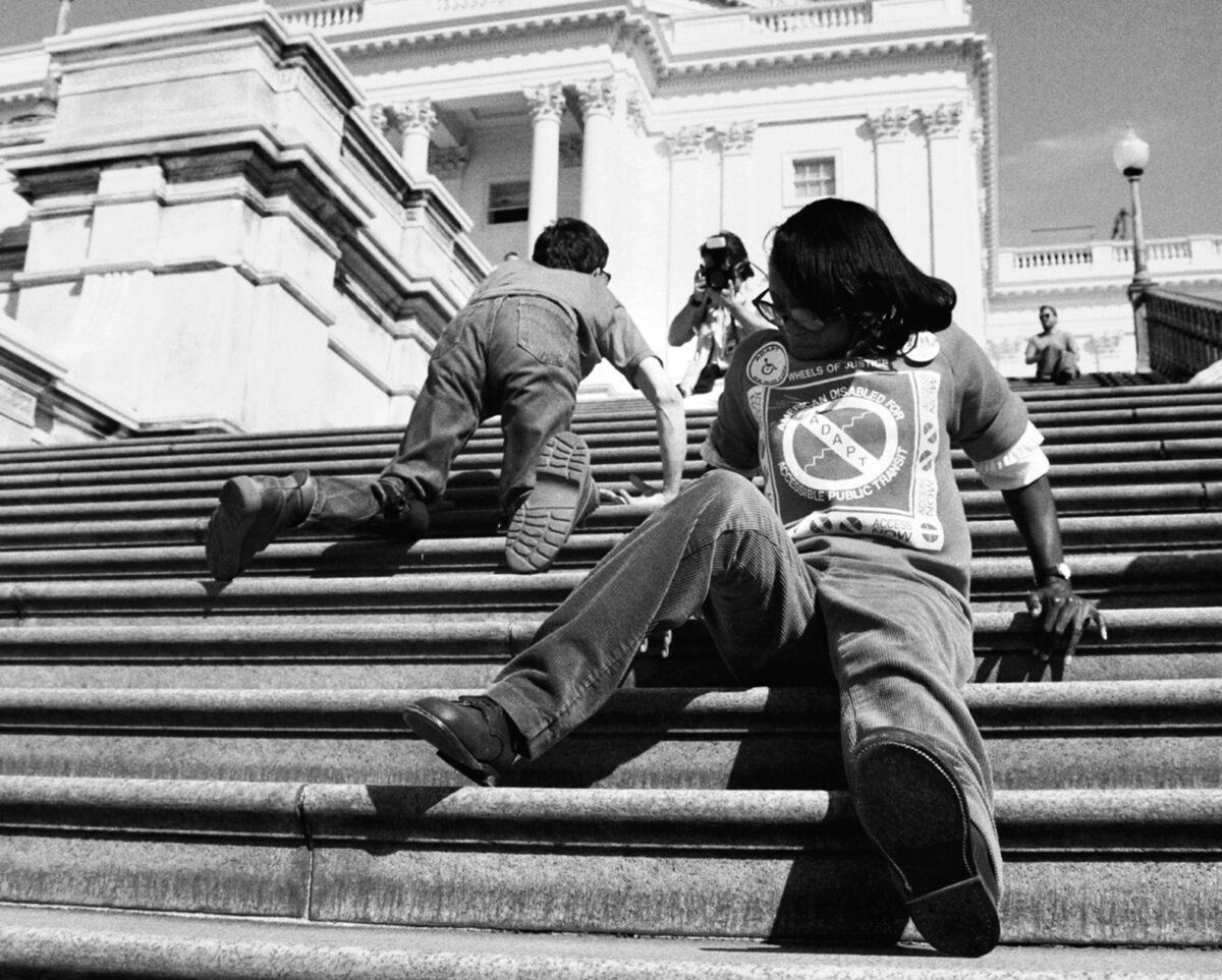 People are seen crawling up the steps of the US. Capitol