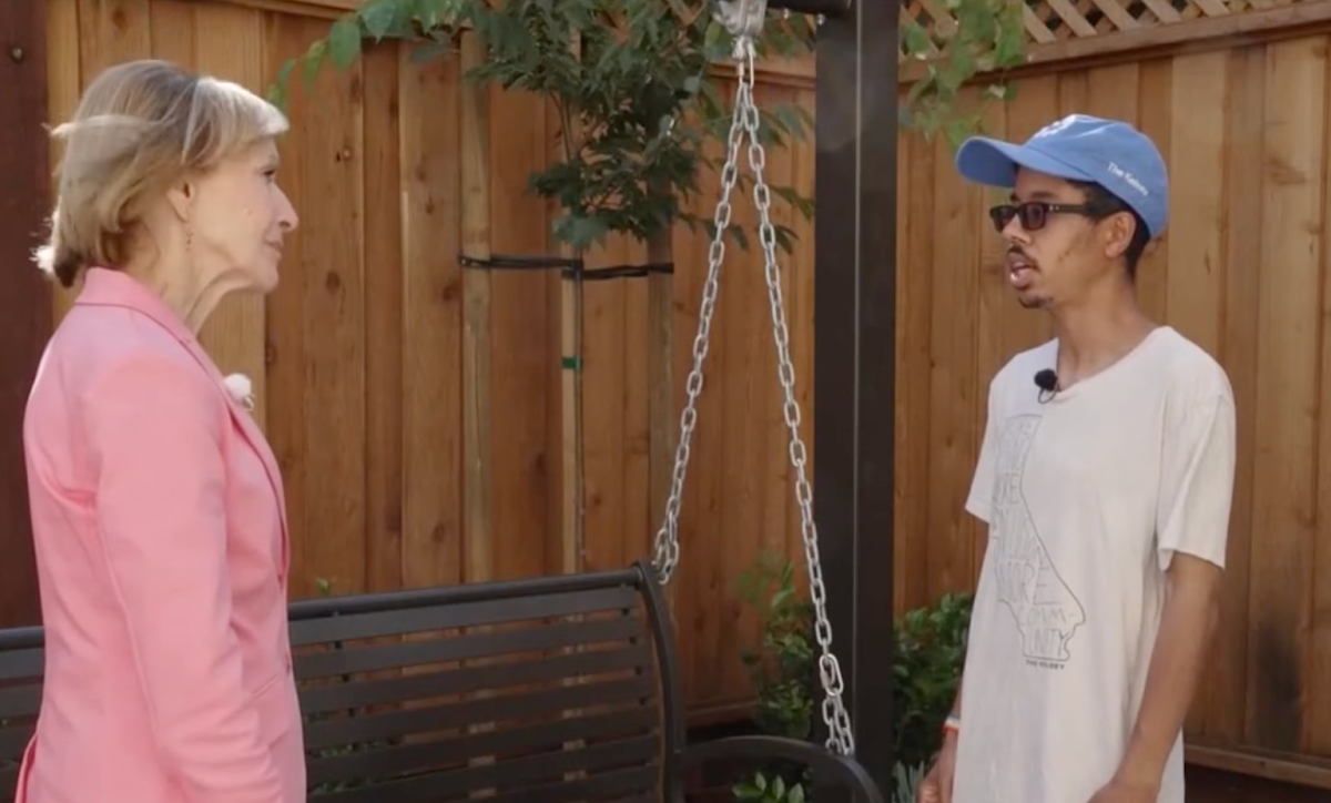 Isaac, The Kelsey’s Operations Assistant, talks with Judy Woodruff, the host of PBS News Hour, in The Kelsey Ayer Station’s sensory garden.