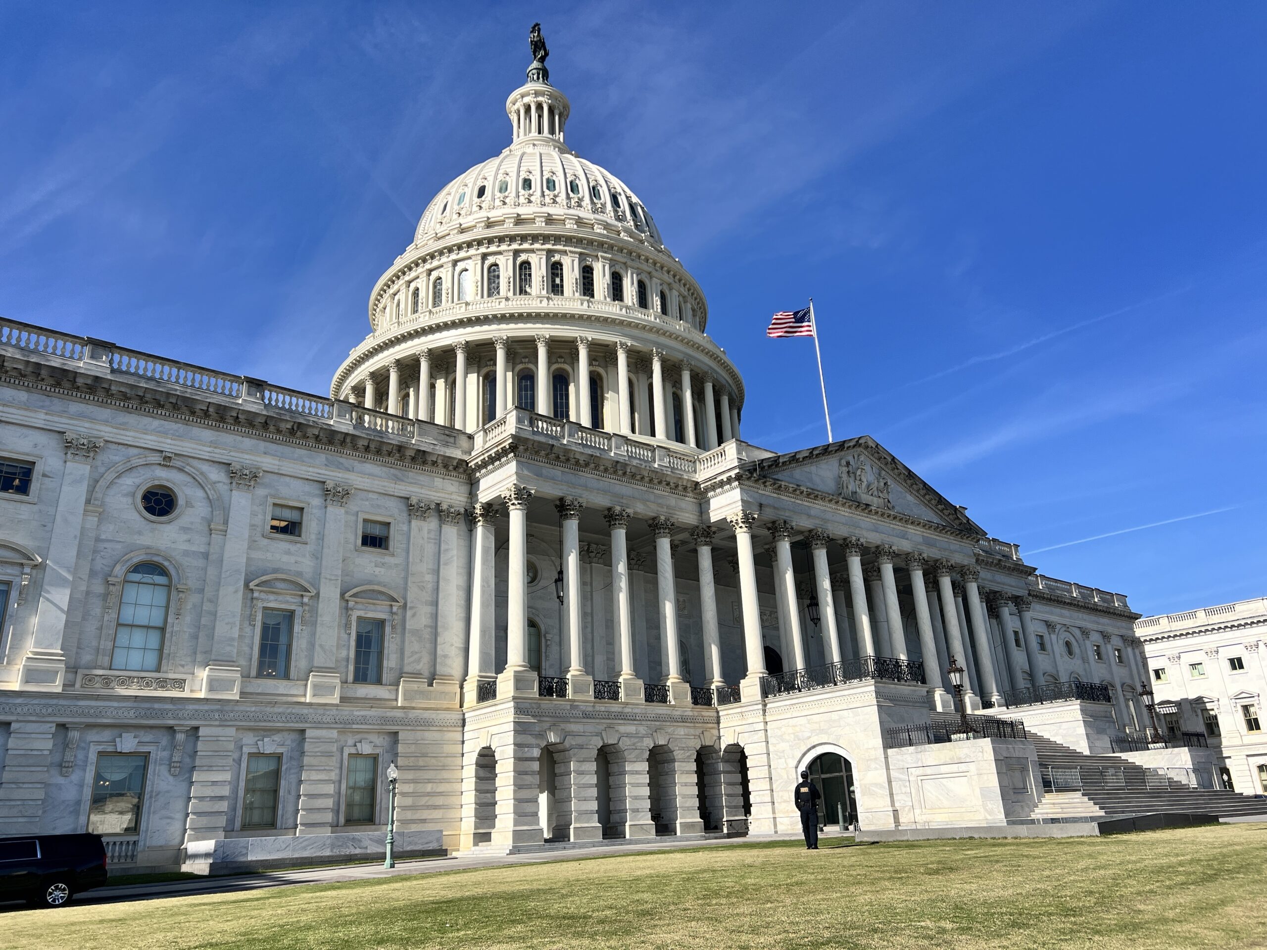 The U.S. Capitol building with a blue sky.