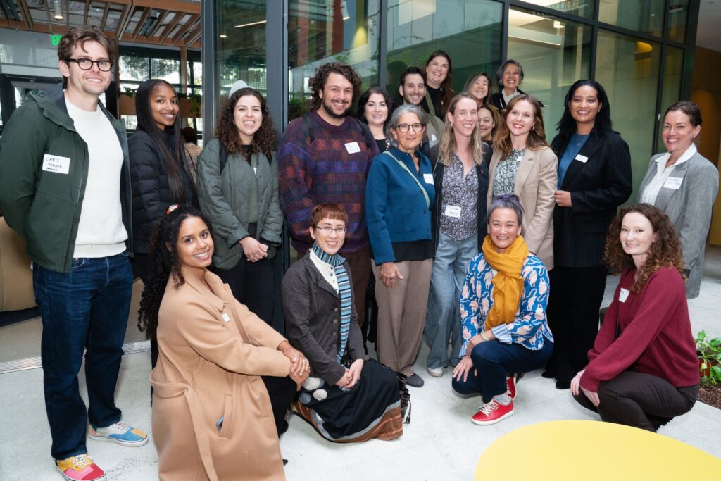 Image Description: A large group of people is pictured together in the lobby of The Kelsey Civic Center.