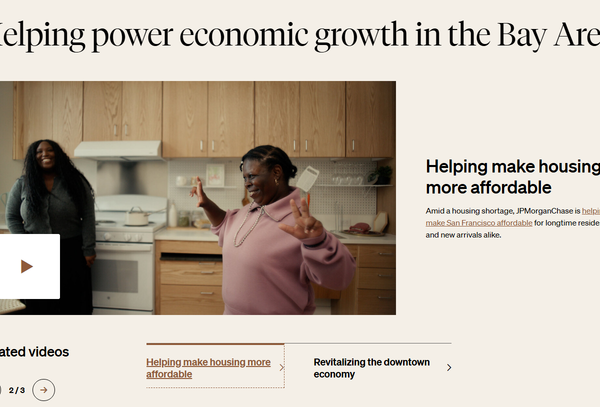 A webpage titled "Helping power economic growth in the Bay Area" featuring a video thumbnail of two Black women smiling and talking in a modern kitchen with light wood cabinets. To the right, text reads, “Helping make housing more affordable. Amid a housing shortage, JPMorganChase is helping make San Francisco affordable for longtime residents and new arrivals alike. The bottom of the page shows a "Related videos" section with links to "Helping make housing more affordable" and "Revitalizing the downtown economy."