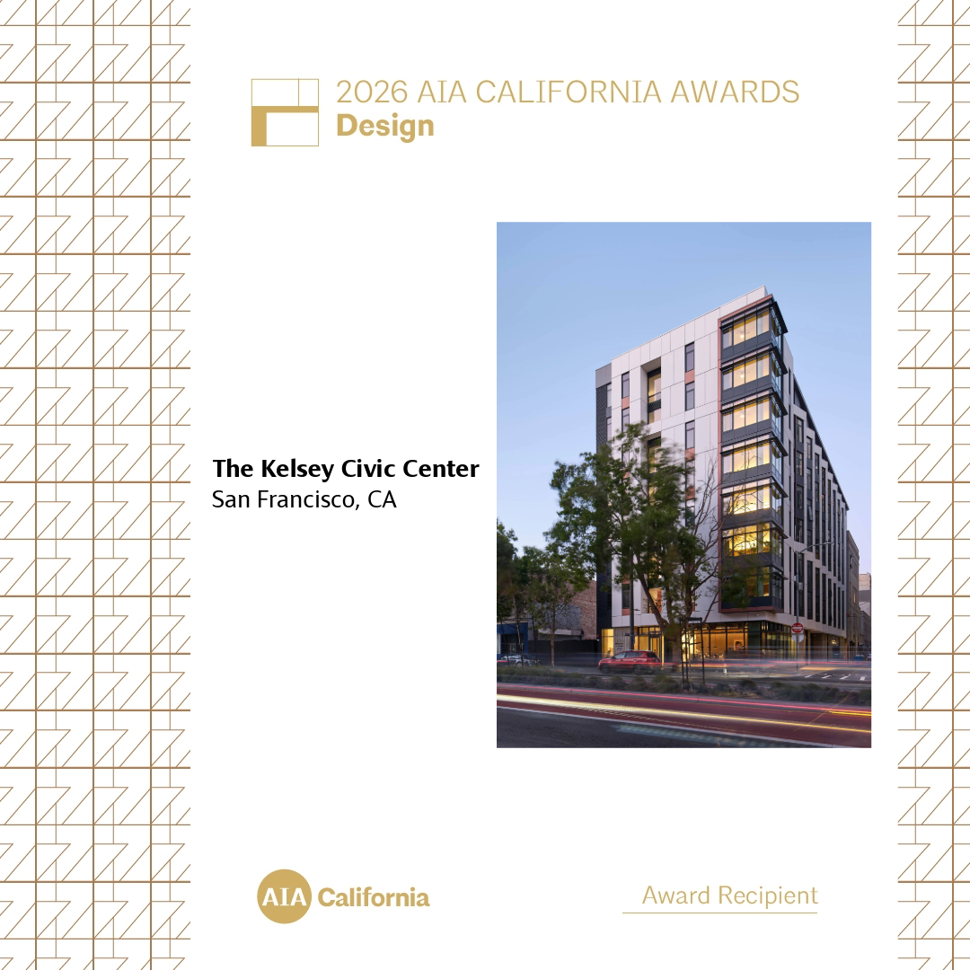 A square graphic on a white background framed by gold geometric line patterns on the left and right borders. At the top left, gold text reads '2026 AIA California Awards Design'. Below this, bold black text reads 'The Kelsey Civic Center, San Francisco, CA'. To the right is a vertical photograph of The Kelsey Civic Center at dusk: a modern, multi-story building with a white-paneled facade, black accent panels, and large windows. Street lights are artistically streaked at the bottom of the photograph. The bottom of the graphic features the gold 'AIA California' logo on the left and the underlined gold text 'Award Recipient' on the right."